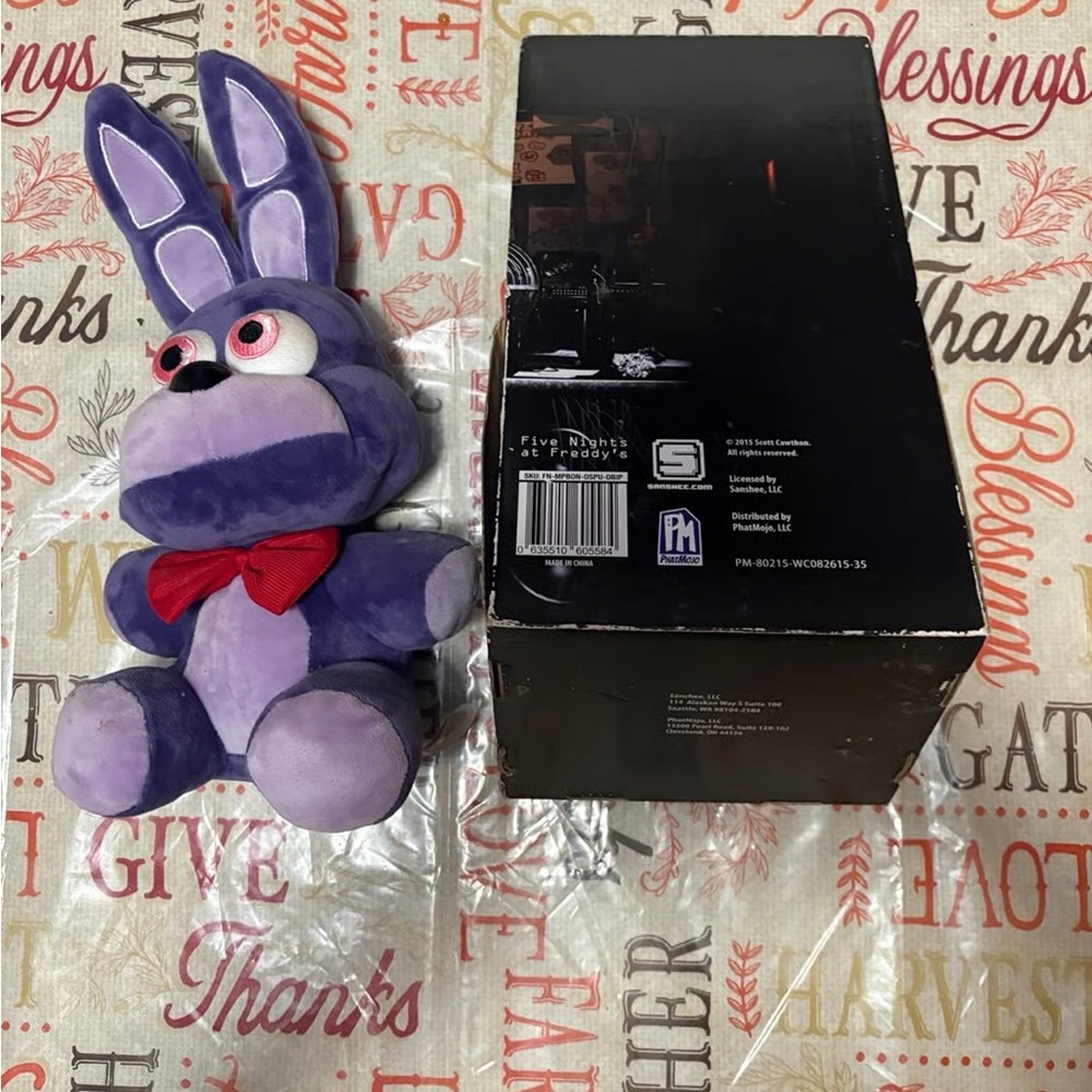 Funko Purple Stuffed Animal with Red Bow